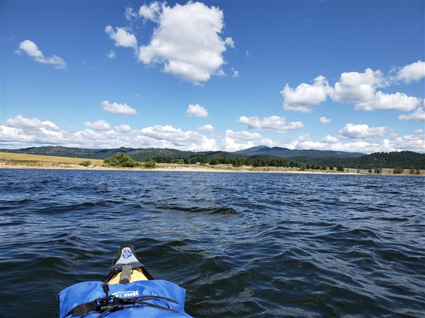 kayaking on cascade lake while rv camping in lake cascade state park